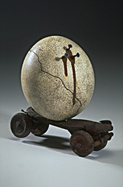 Ostrich egg balanced on skate